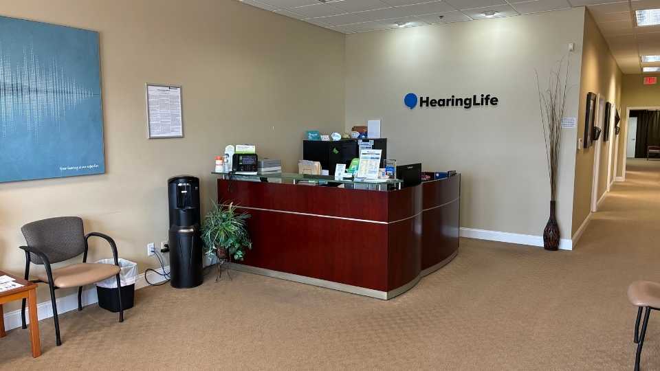 Greenfield WI HearingLife lobby reception area featuring seating and informational displays