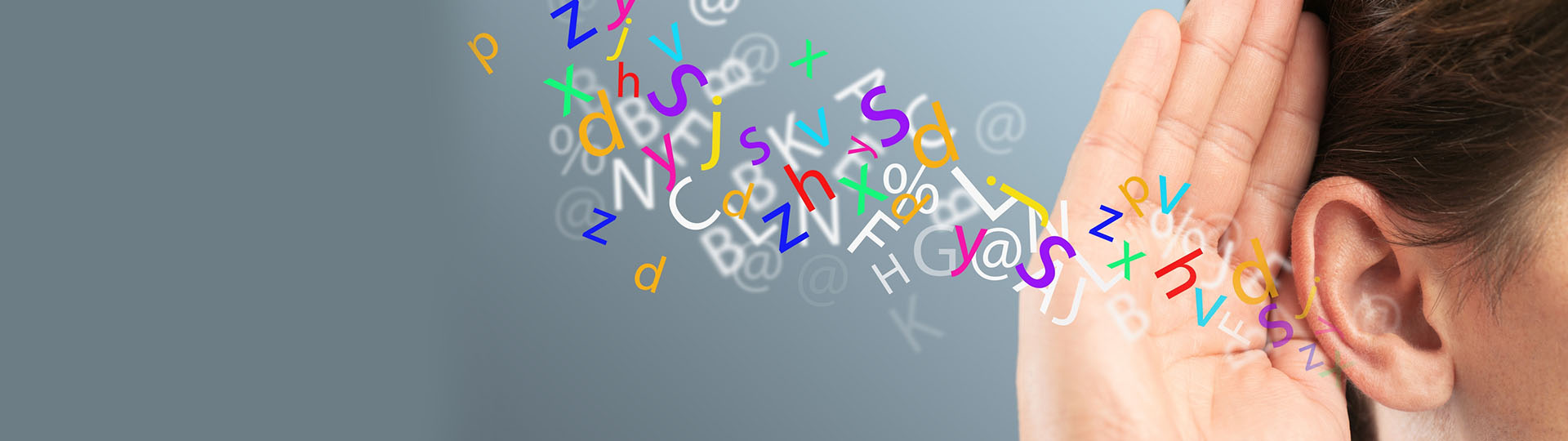 Colorful letters and symbols flowing toward a person's ear, symbolizing auditory processing and hearing difficulties.
