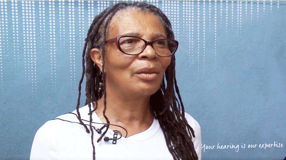 woman enjoying improved hearing with advanced hearing aids