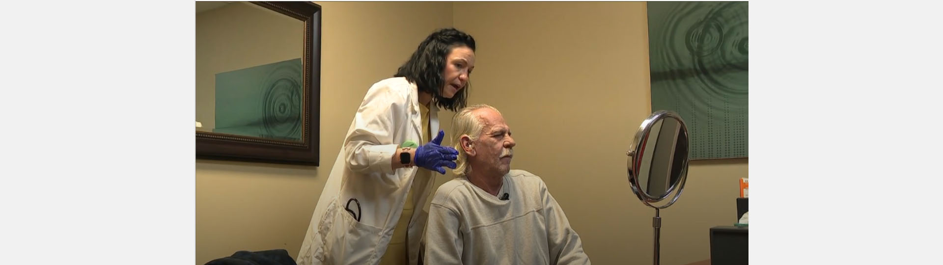 man fitting hearing aids with assistance through Campaign for Better Hearing