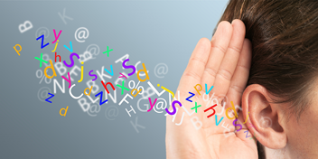 Colorful letters flowing toward a hand cupped around an ear, representing auditory perception and hearing enhancement.