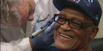 Joe Thompson, a Grammy-winning singer, undergoes a hearing evaluation while receiving hearing aids.