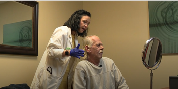 man undergoing hearing aid fitting provided by Campaign for Better Hearing