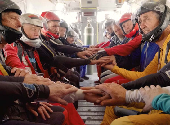 Skydiving Over 60 - Group of skydivers in the plane before the jump