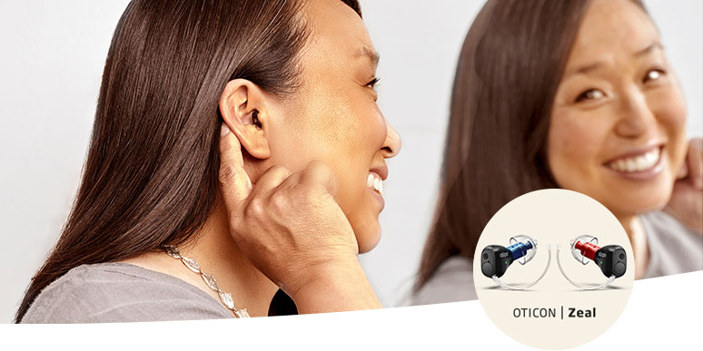 Smiling woman wearing Oticon Zeal hearing aids