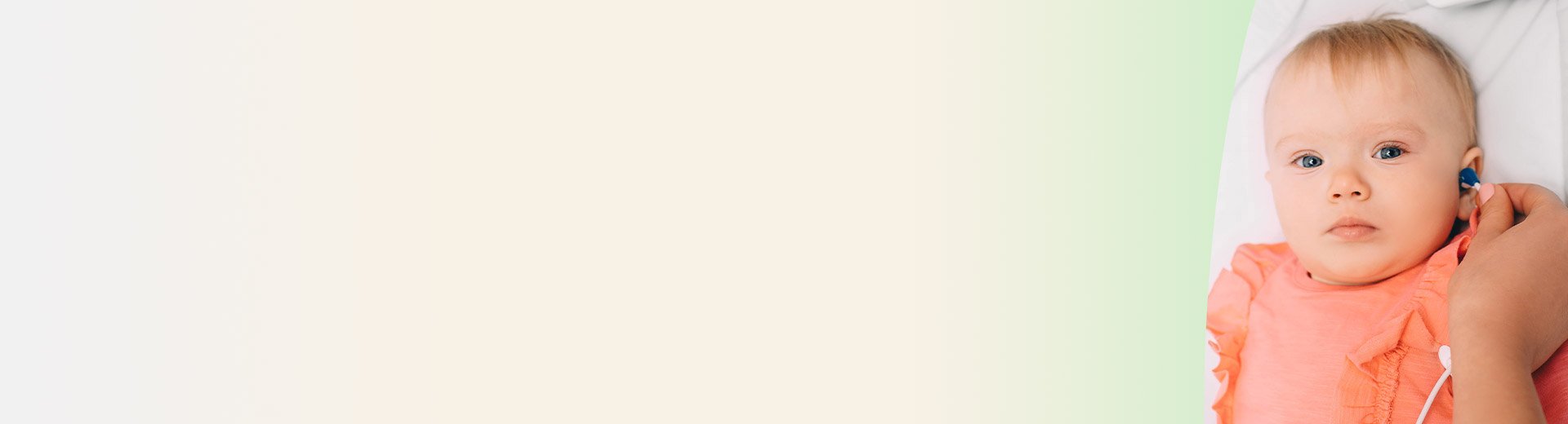 Baby getting her hearing tested