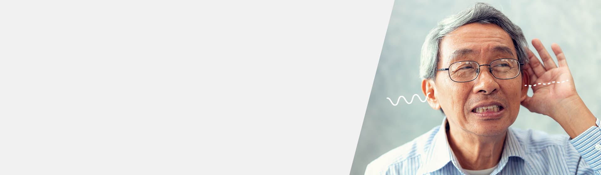 Man experiencing unilateral hearing loss holding hand to ear