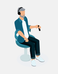 Man sitting on a chair wearing headphones and holding a hearing test response button.