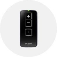 Remote control for Oticon hearing aids with volume adjustment buttons and a sleek black design.