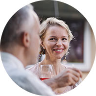 Image show people talking at dinner