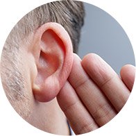 Hand cupped behind an ear, symbolizing listening or hearing difficulty.
