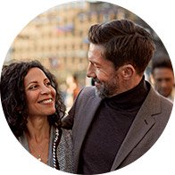 Image shows man and woman looking at each other