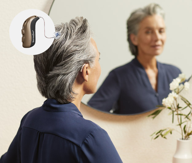 Image shows person wearing Bernafon Alpha hearing aids