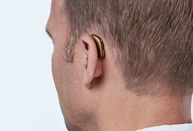 image shows hearing aids behind the ear