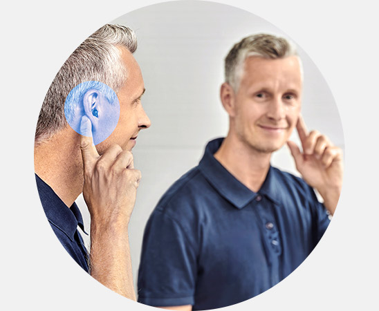 Man wearing Oticon Zeal hearing aid with built-in tinnitus treatment