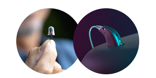 A hand holds a discreet in-the-ear hearing aid on the left, while a sleek behind-the-ear hearing aid with a glowing indicator rests on a surface in a dark setting on the right.