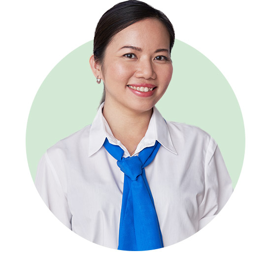 Smiling woman wearing a white shirt and blue necktie, standing against a light green circular background.