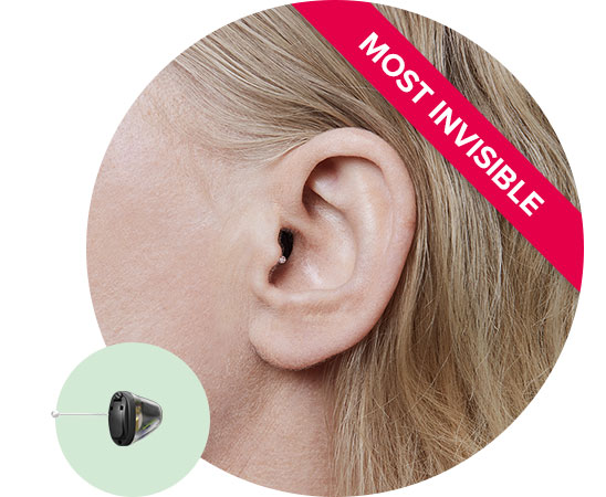 Invisible-in-the-canal hearing aid positioned discreetly inside the ear with a red banner labeled 'Most Invisible.'
