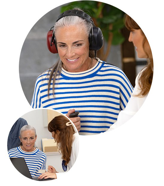 A person wearing a blue-and-white striped shirt is undergoing a hearing test with large black and red headphones in a clinic setting. An audiologist reviews results on a laptop nearby.